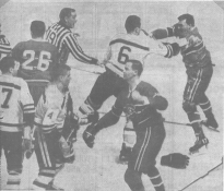 Ted Harris and Bobby Orr mix it up