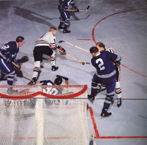 Hillman checks Hull infront of Sawchuck